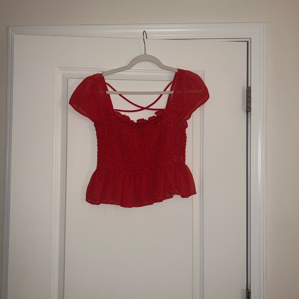 Forever 21 red dotted shirt. Size large and is cropped a little.